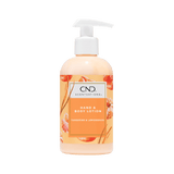 Single pump bottle of body lotion, orange lotion.